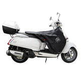 Coprigambe Termoscud R151X, un coprigambe impermeabile con fodera termica. Utilizzato su scooter. Di Tucano Urbano.